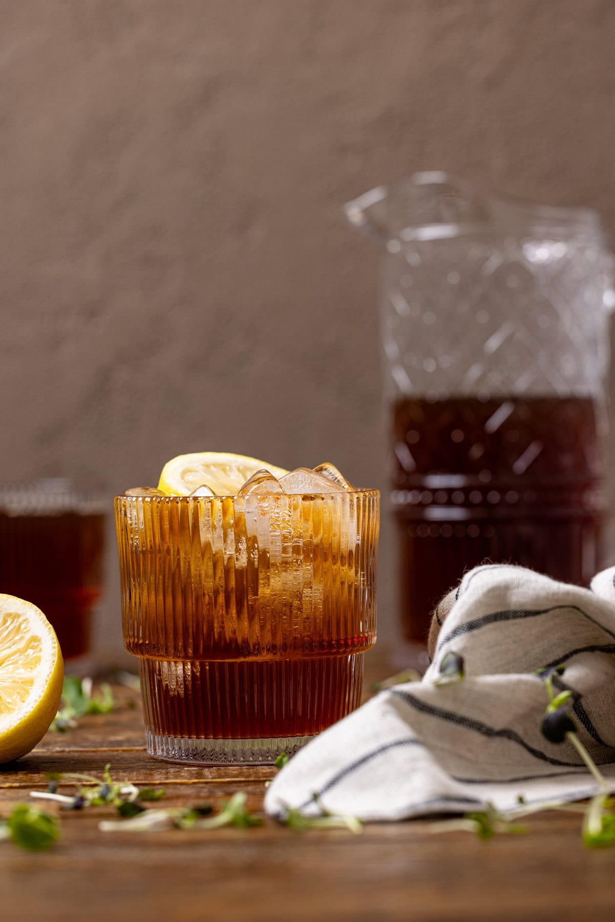 Sweet Tea in glasses and a pitcher with lemons.