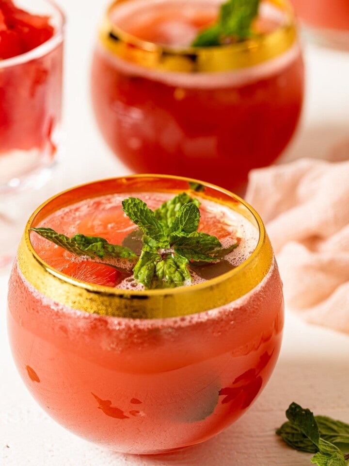 Fresh Watermelon Cucumber Mint Juice in a gold-rimmed glass.