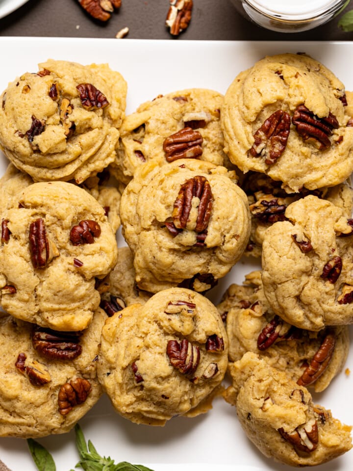 Up close shot of baked cookies on a white plate.