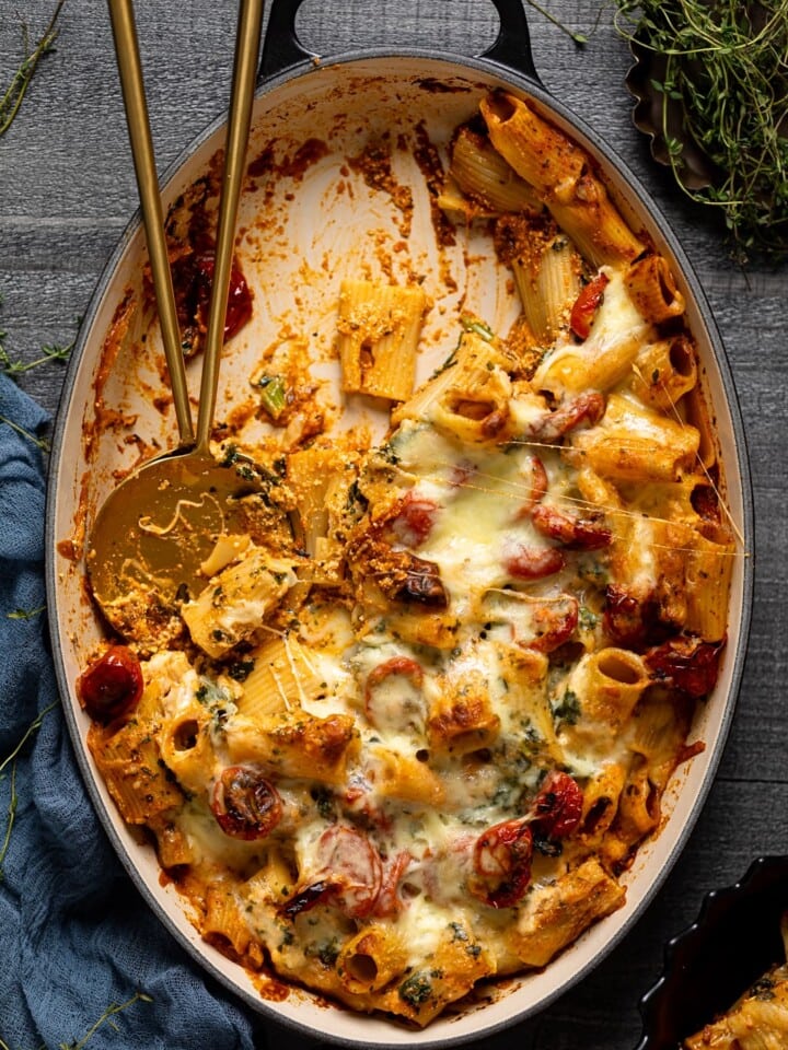 Half-empty Dutch oven of Meatless Baked Ziti with Ricotta and Mozzarella