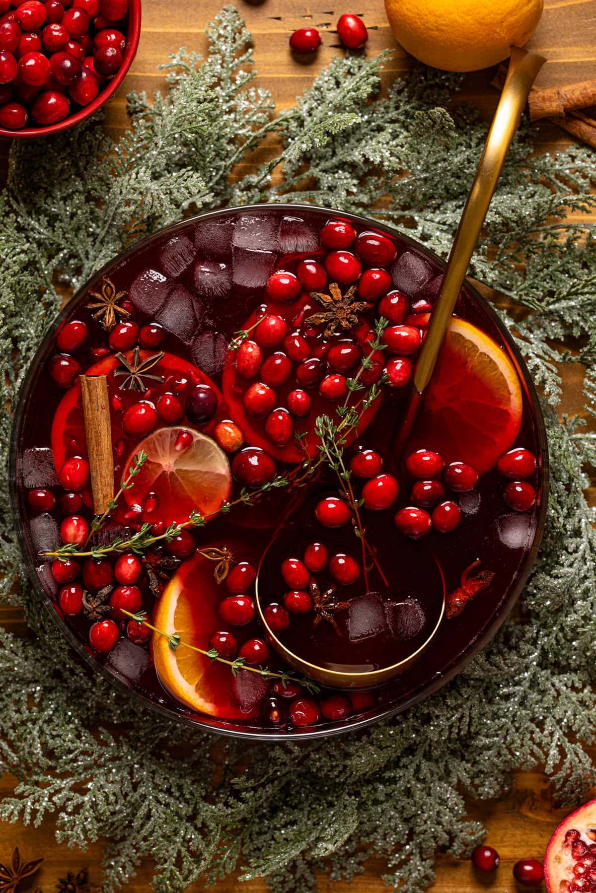 Christmas Punch in a bowl with a serving spoon and decor.