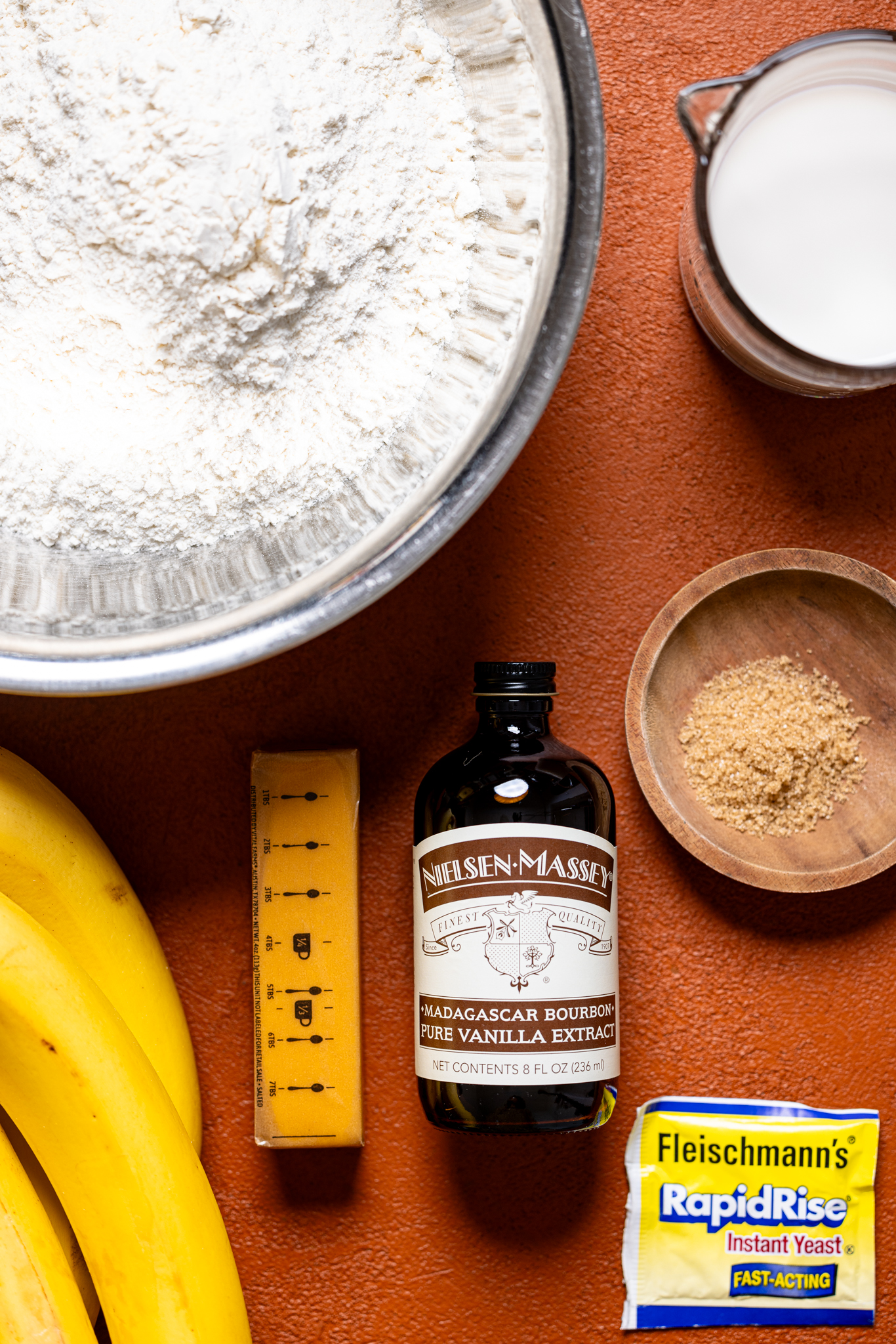 Ingredients on a burnt orange table.