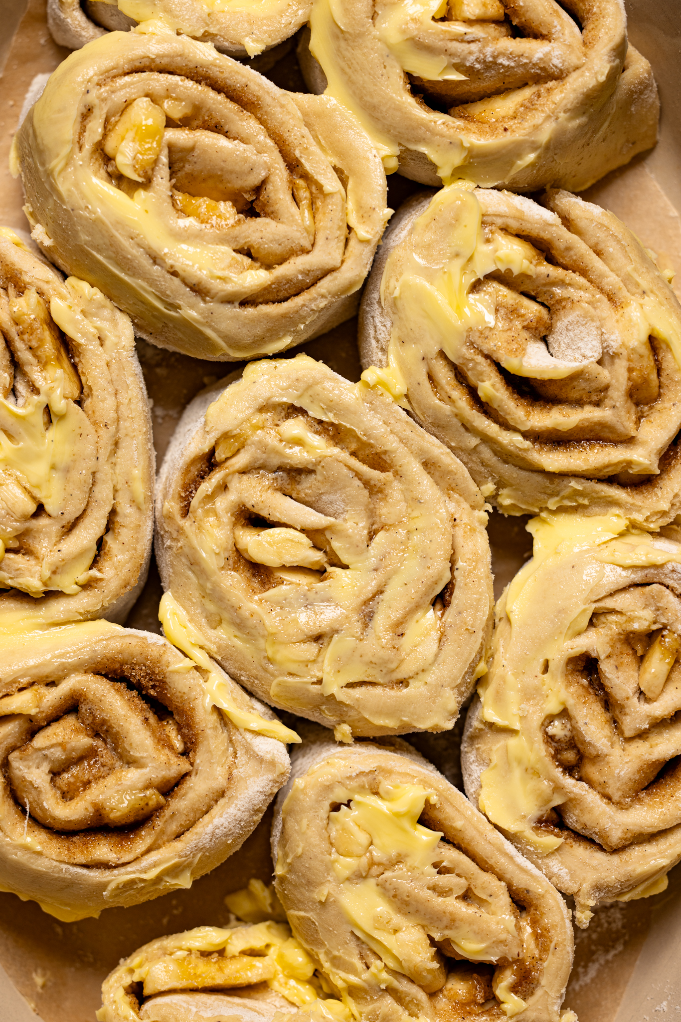 Cinnamon rolls prepped in a baking dish.