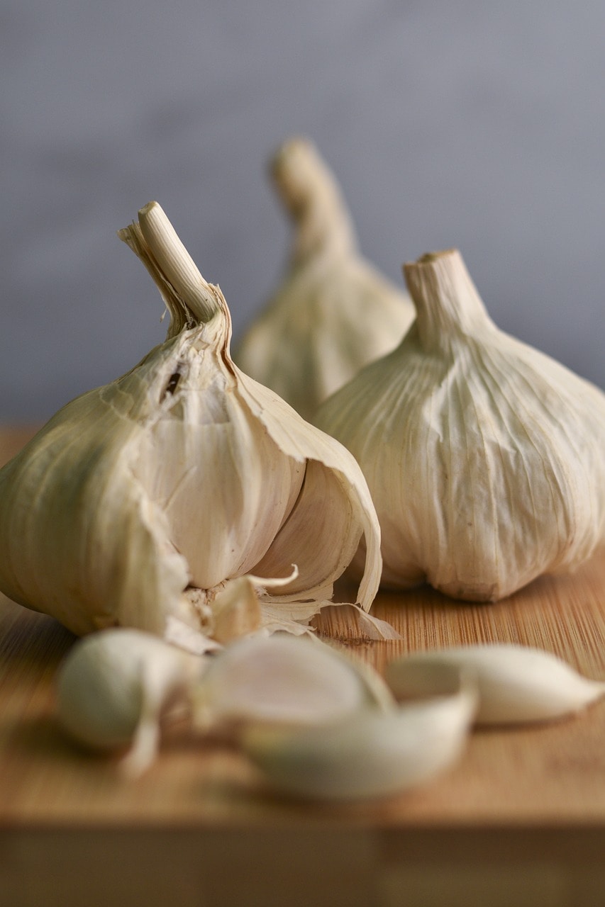 Garlic bulbs on a wooden table.