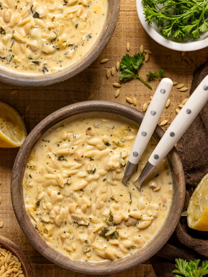 Up close shot of soup with two spoons.