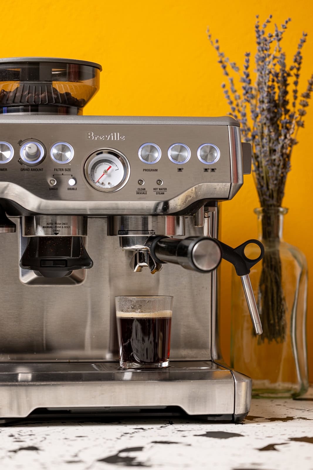 Espresso machine with brewed coffee.