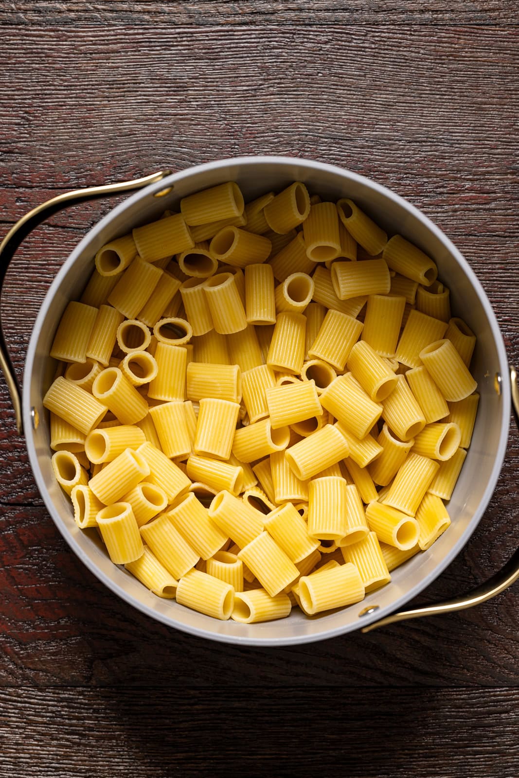 Cooked rigatoni pasta in a pot.