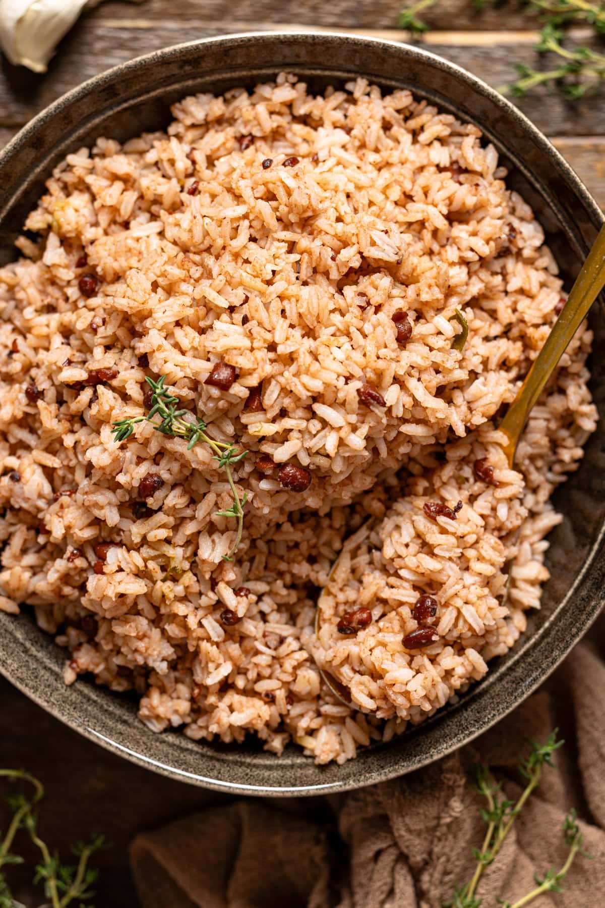 Up close shot of rice and peas in a serving bowl.