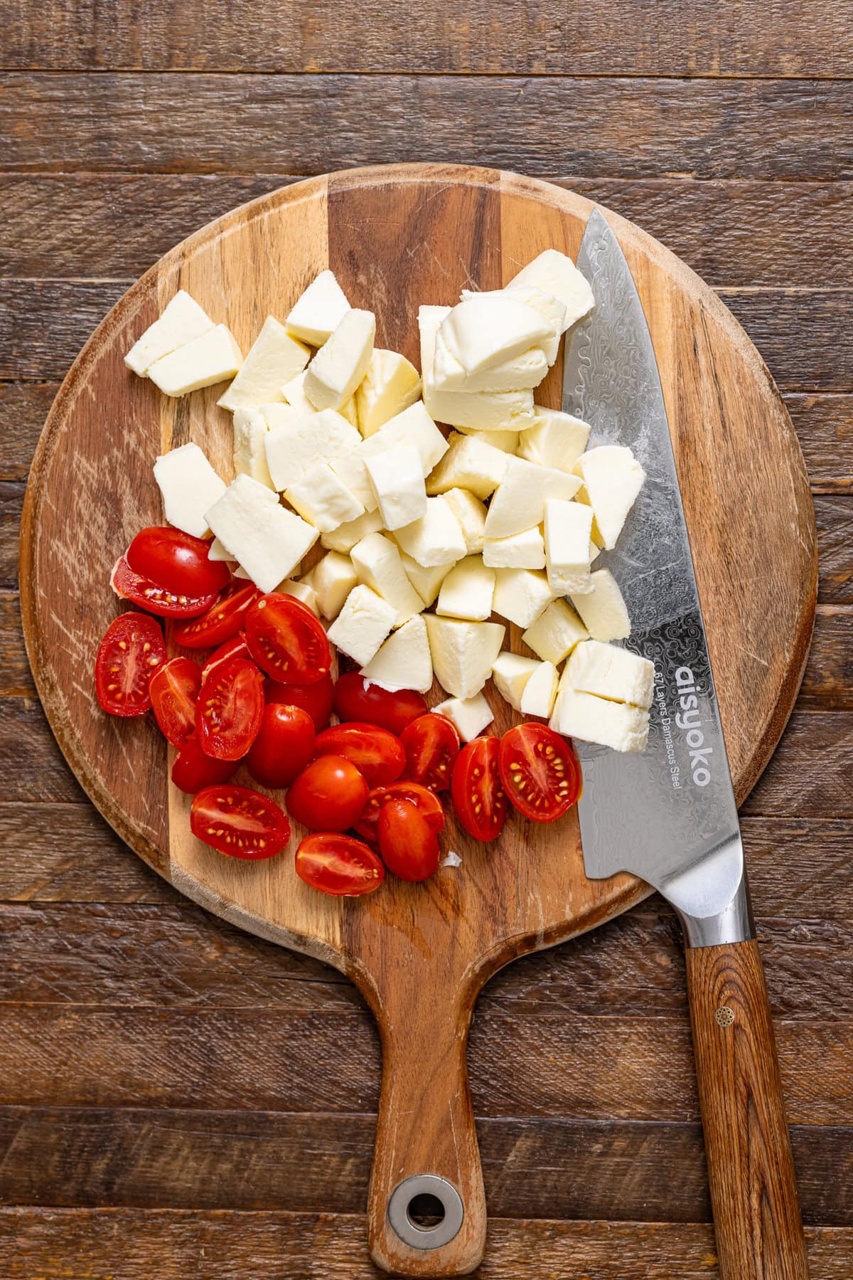 Ingredients on a cutting board with a knife.