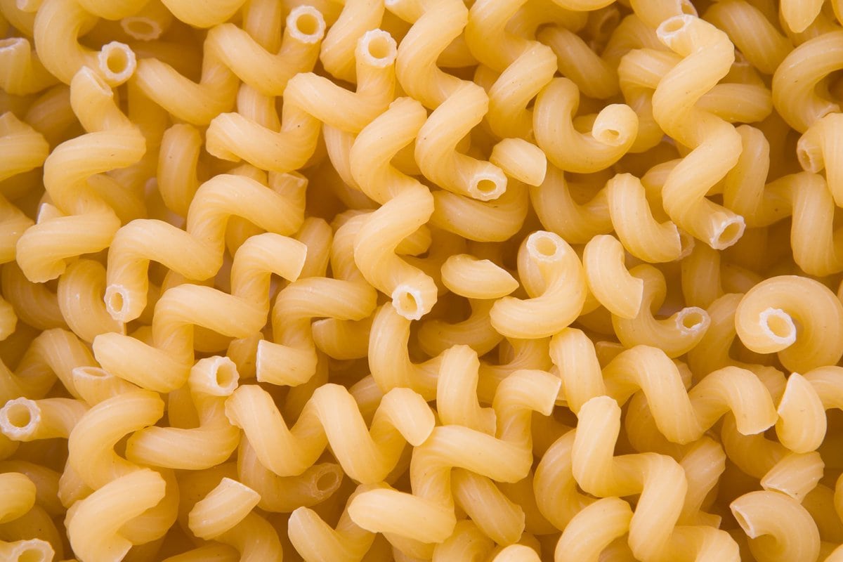 Cavatappi curly spiral pasta taking up entire image.