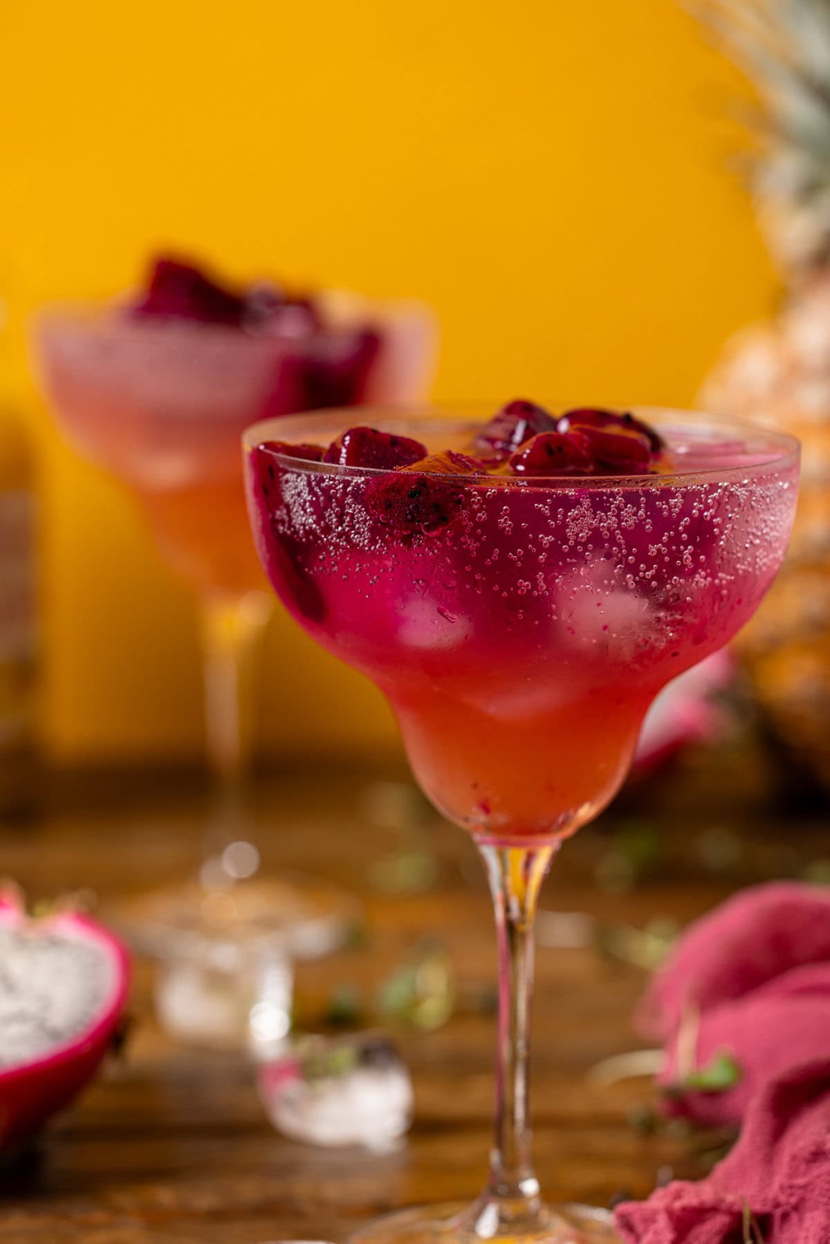 Up close shot of mocktail with a yellow background.