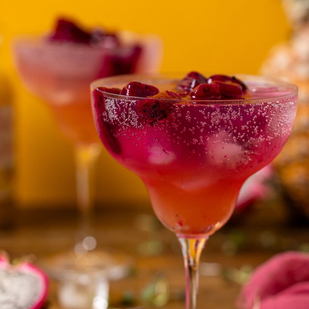 Up close shot of mocktail with a yellow background.