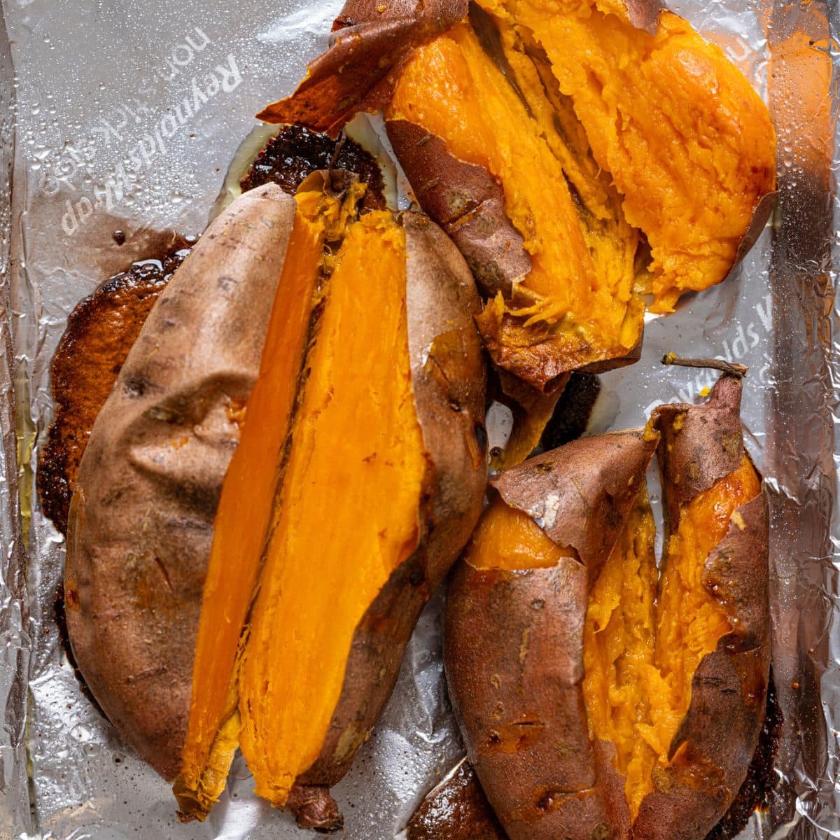 Cut baked sweet potatoes on a baking sheet with foil paper.