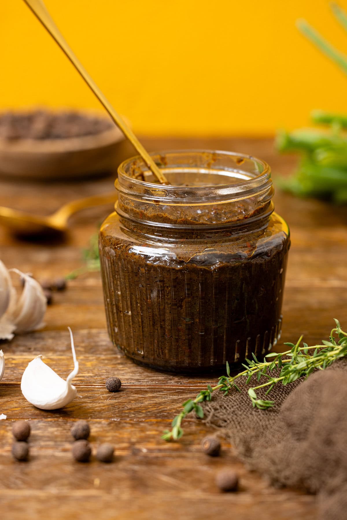 Jerk marinade in a jar with ingredients.