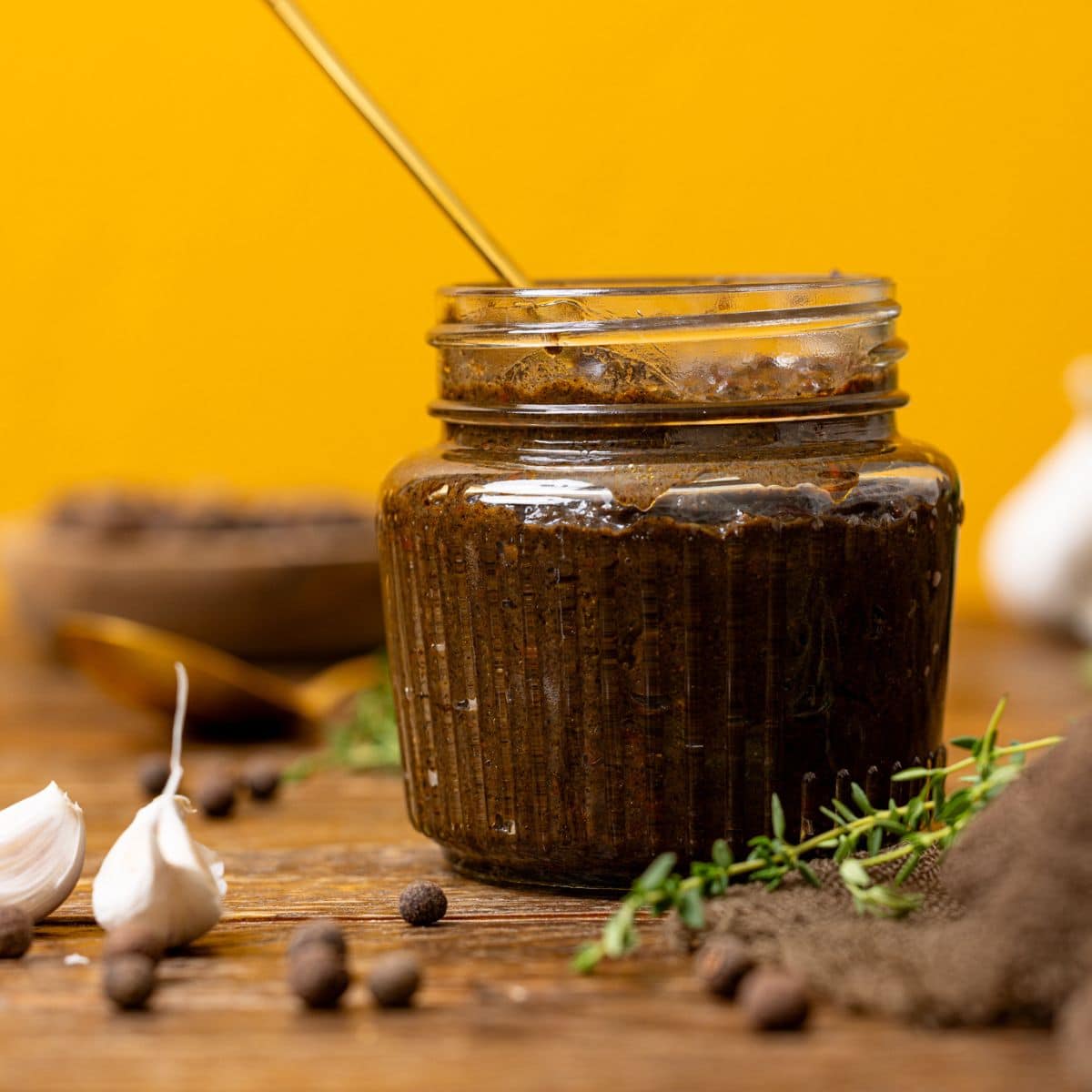 Marinade in a jar with a spoon.