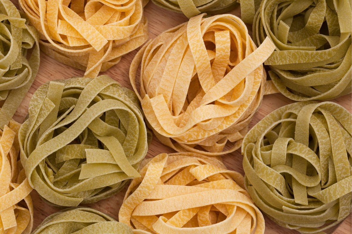 Tagliatelle pasta uncooked in balls.