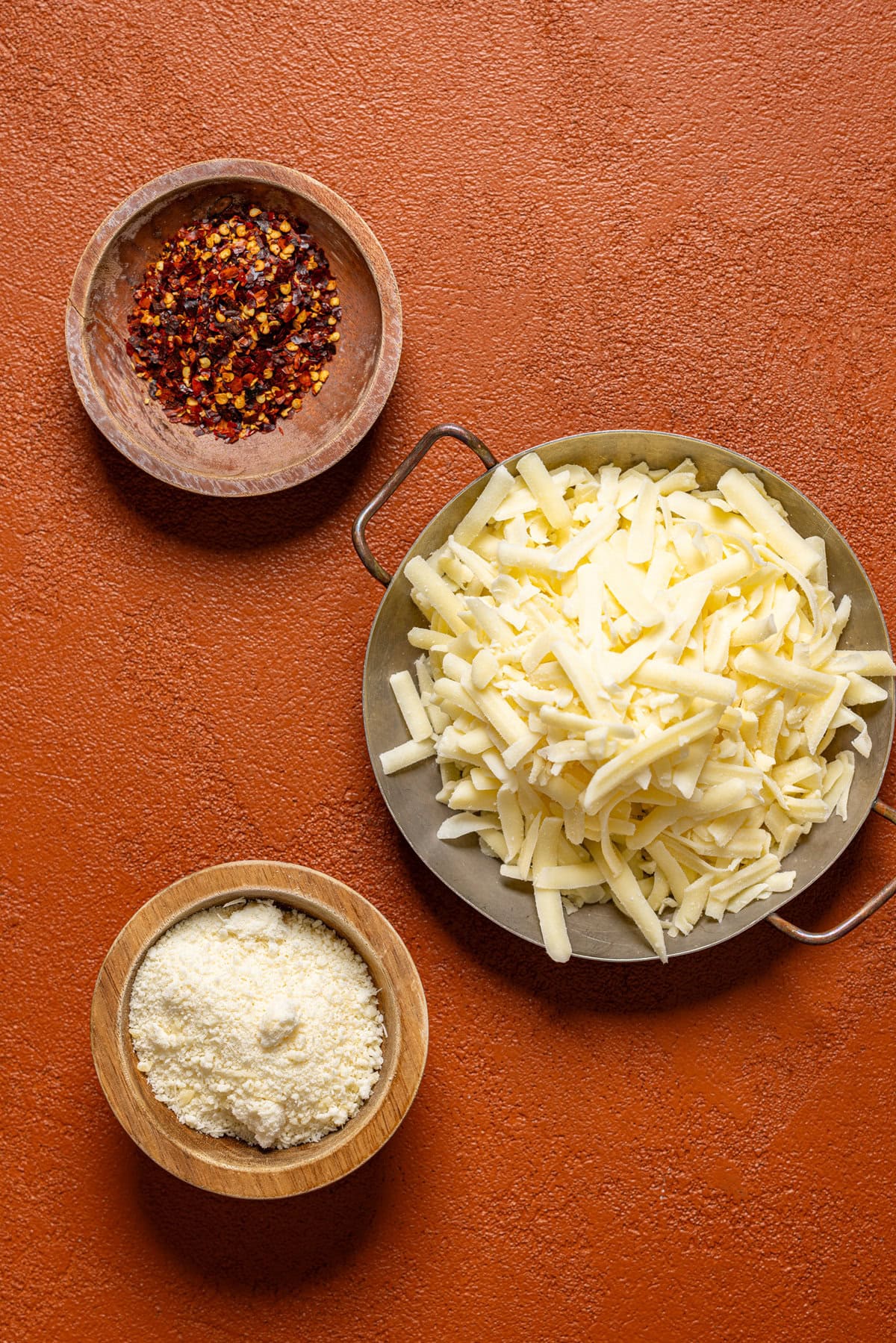 Ingredients on a burnt orange table. 