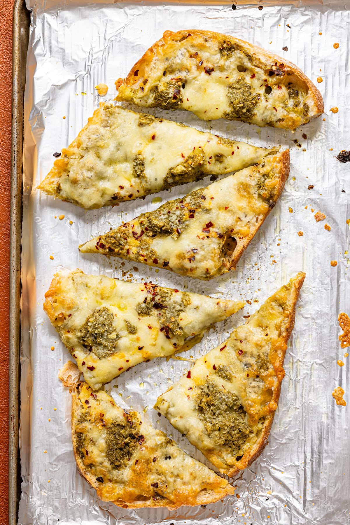 Baked garlic bread on a baking sheet with foil paper. 