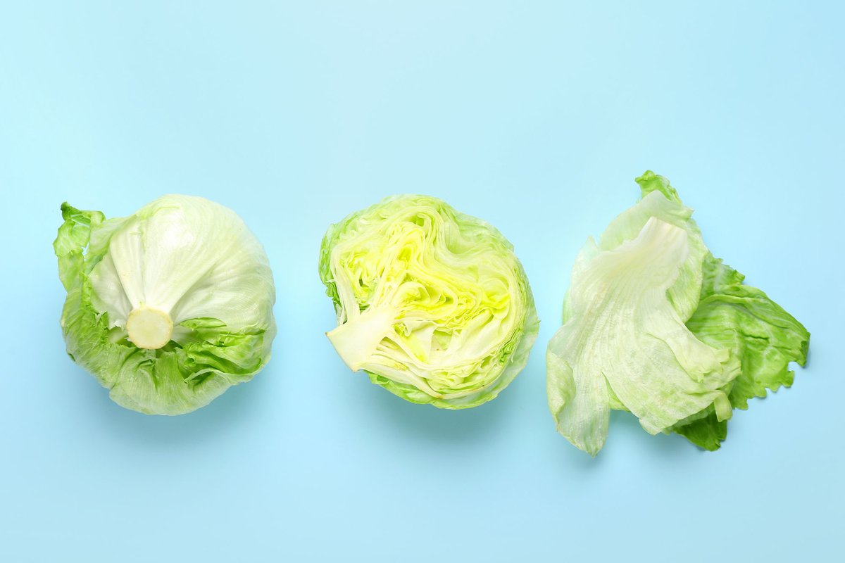 3 iceberg lettuce on blue background.