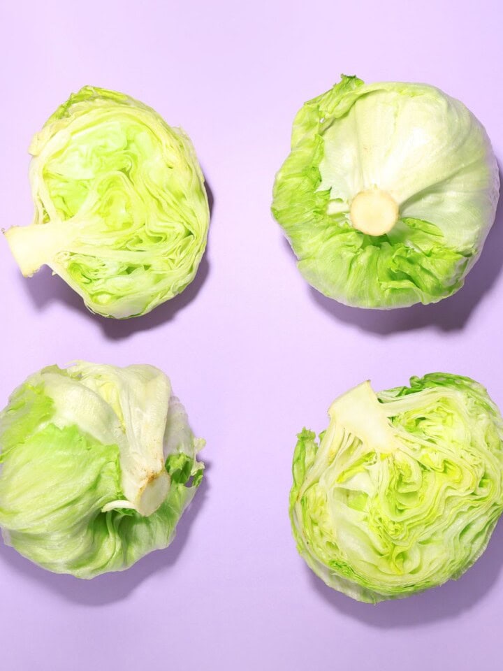 Iceberg lettuce on pink backdrop.