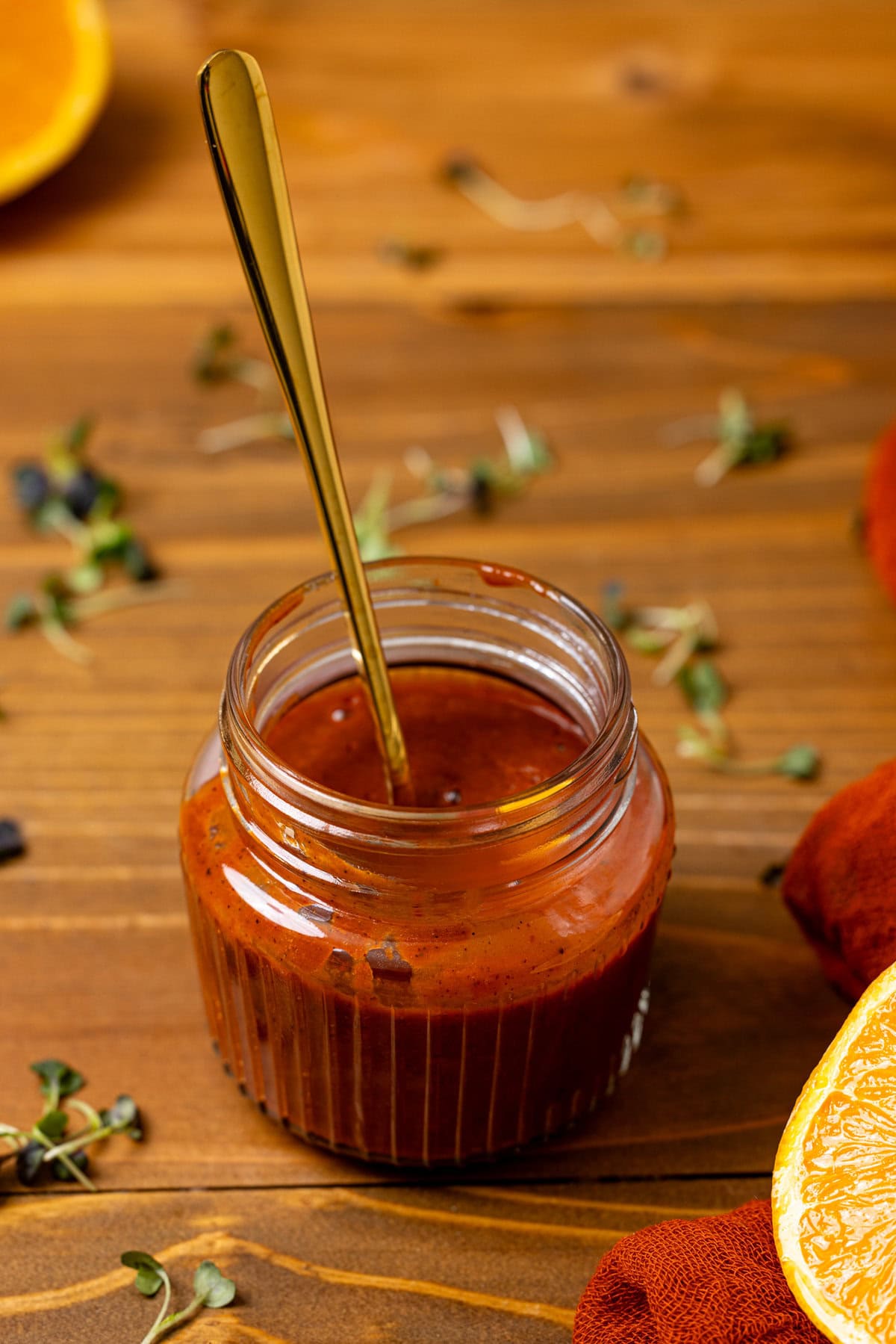 Al Pastor Marinade in a mason jar with a spoon.