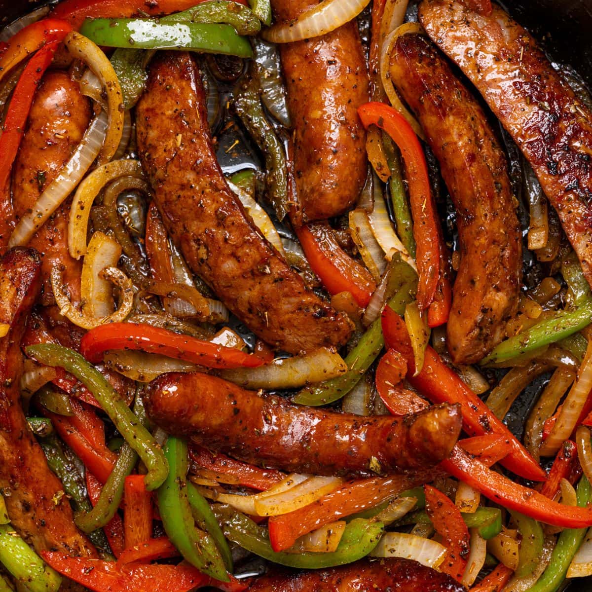 Up close shot of sausage + peppers.