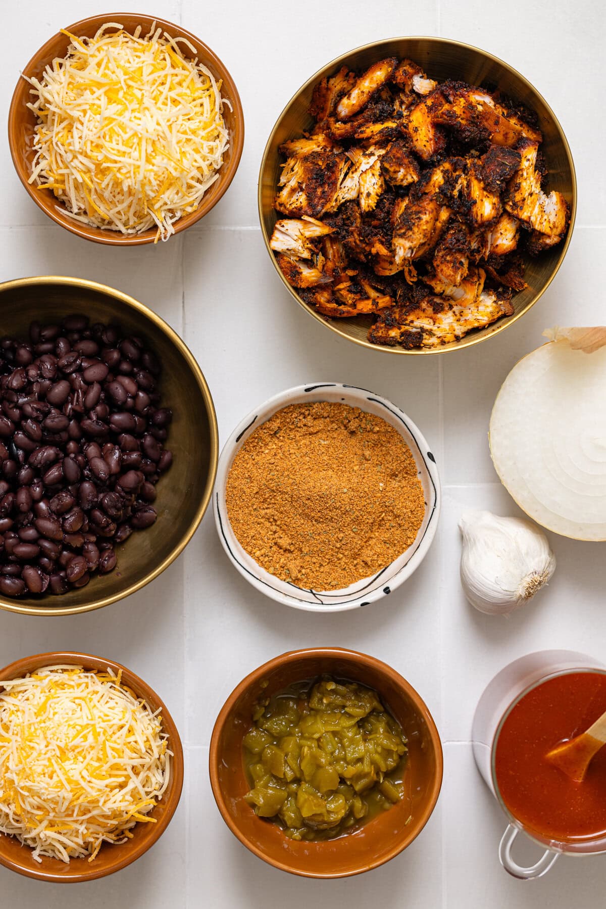 Ingredients on a white tile table.