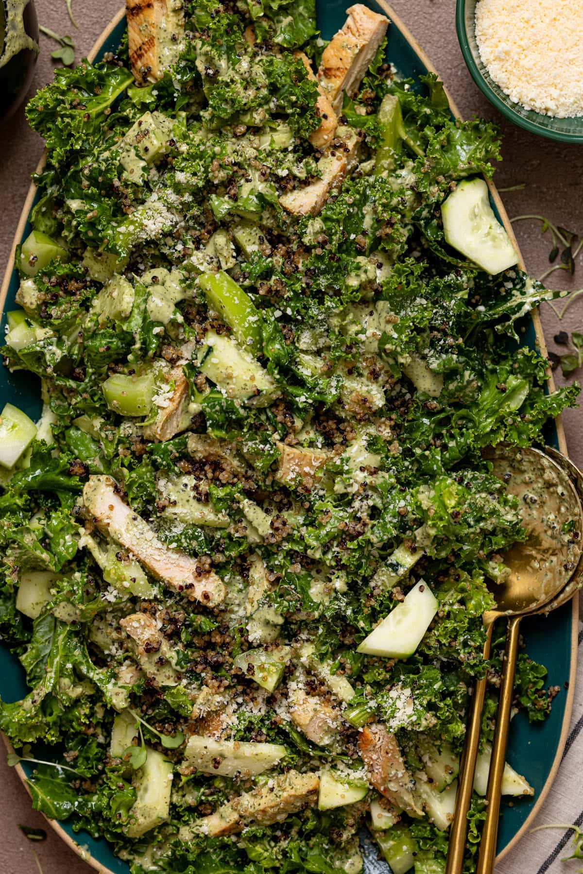 Green goddess chicken salad tossed together on a platter.