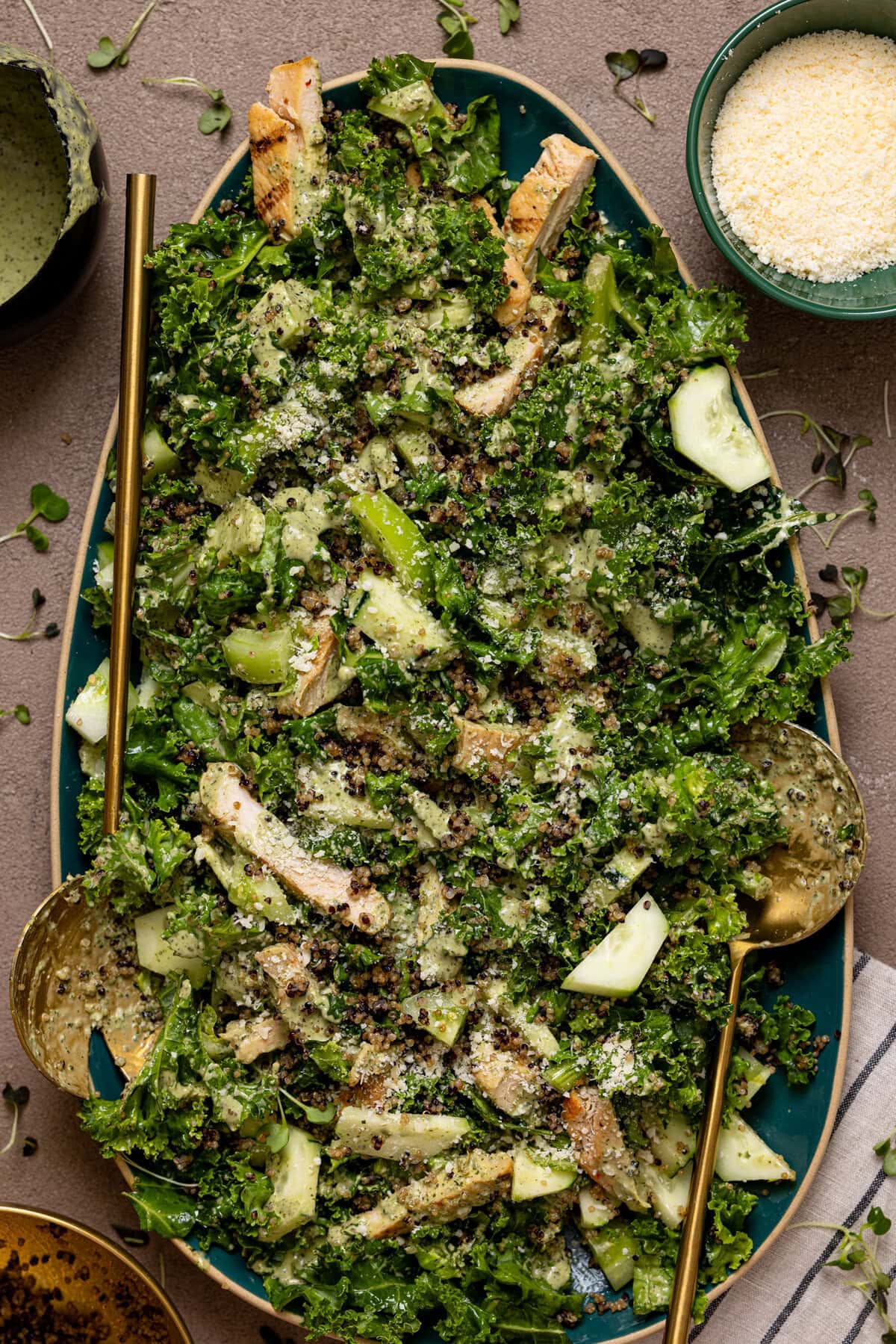 Green goddess chicken salad on a platter with crunchy quinoa.