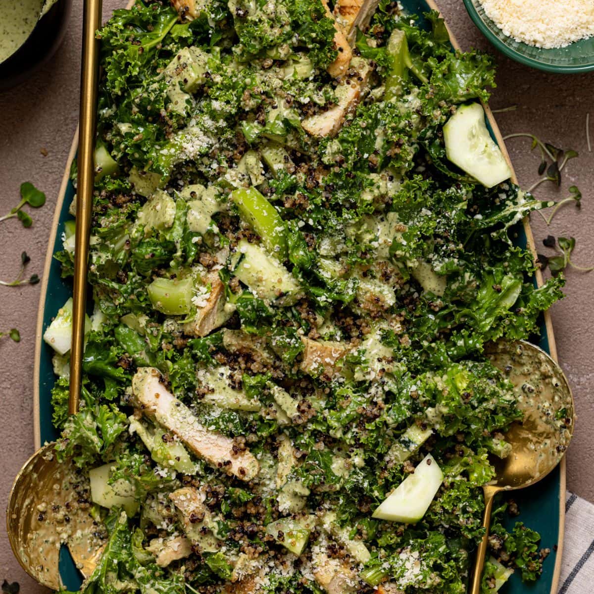 Green goddess chicken salad on a platter with crunchy quinoa.