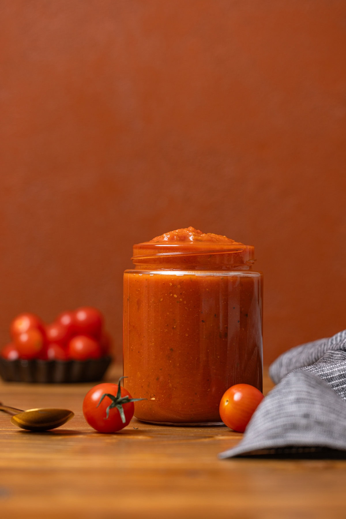 Vodka sauce in a jar on a brown wood table.