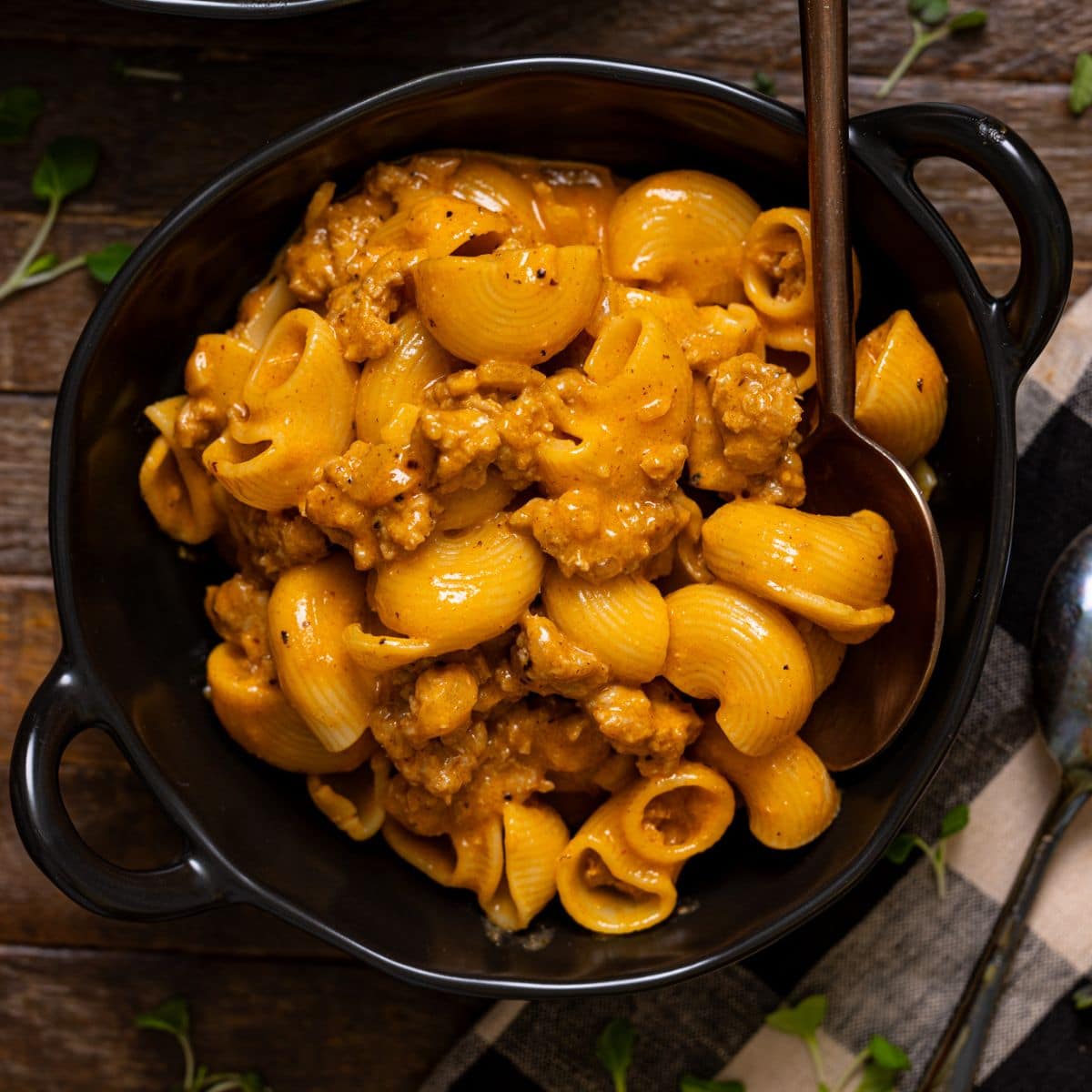 Up close shot of hamburger helper in a bowl with a spoon.