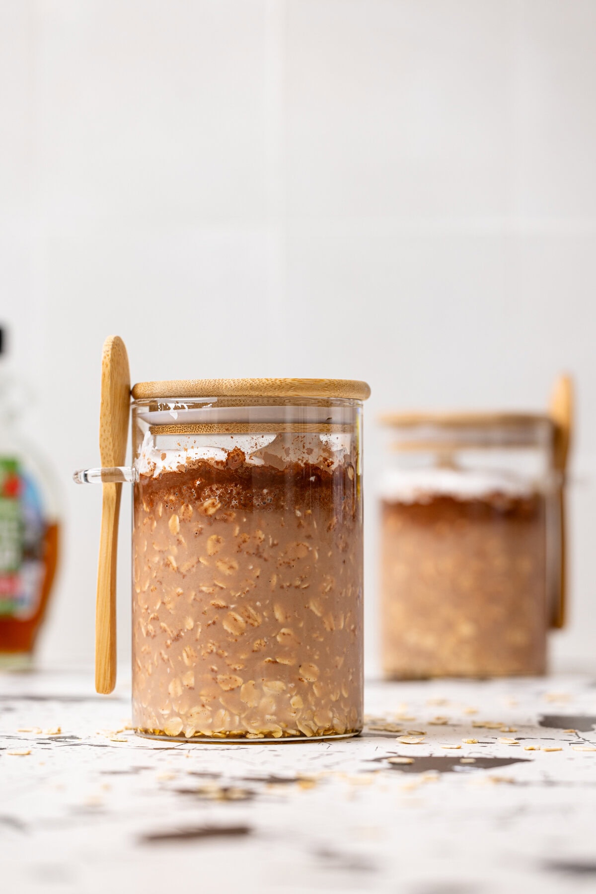 Ingredients stirred together in jars with spoons.