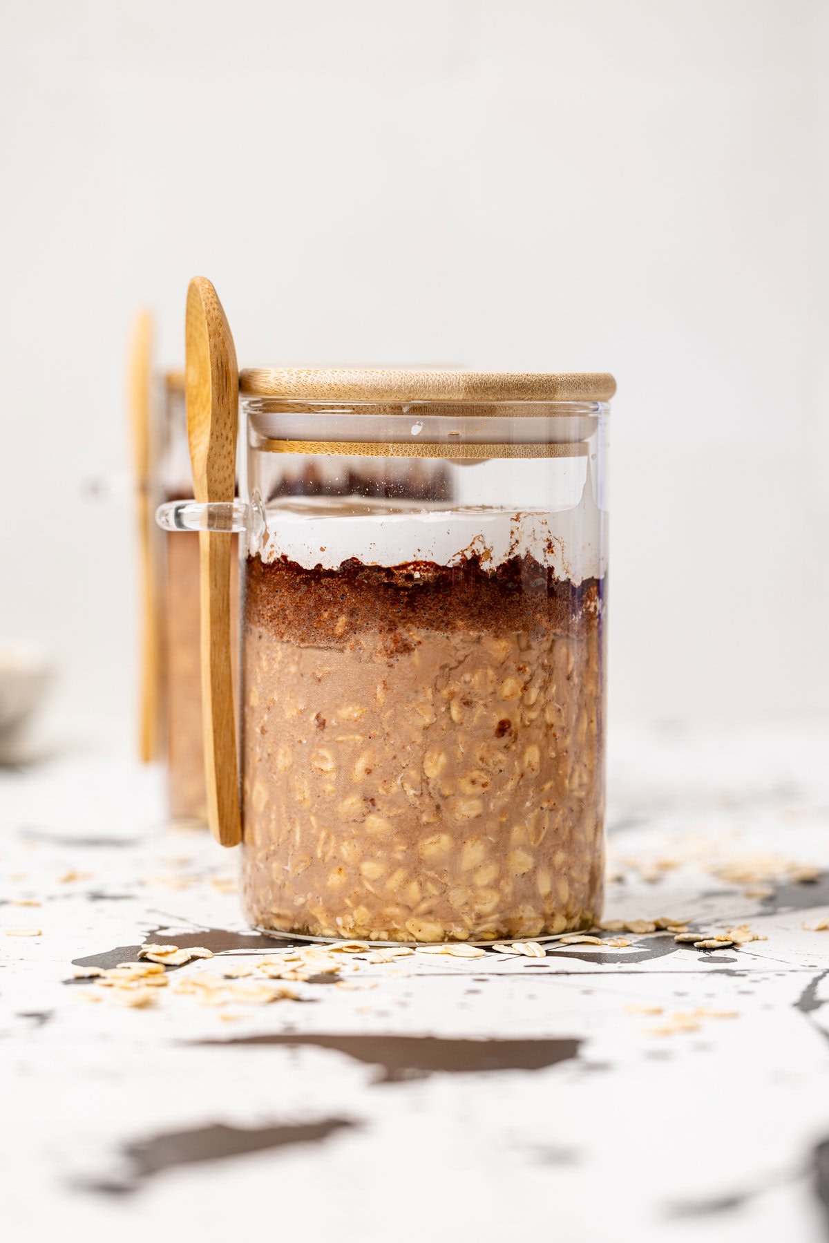 Overnight oats in two jars topped with a bit of marshmallow.