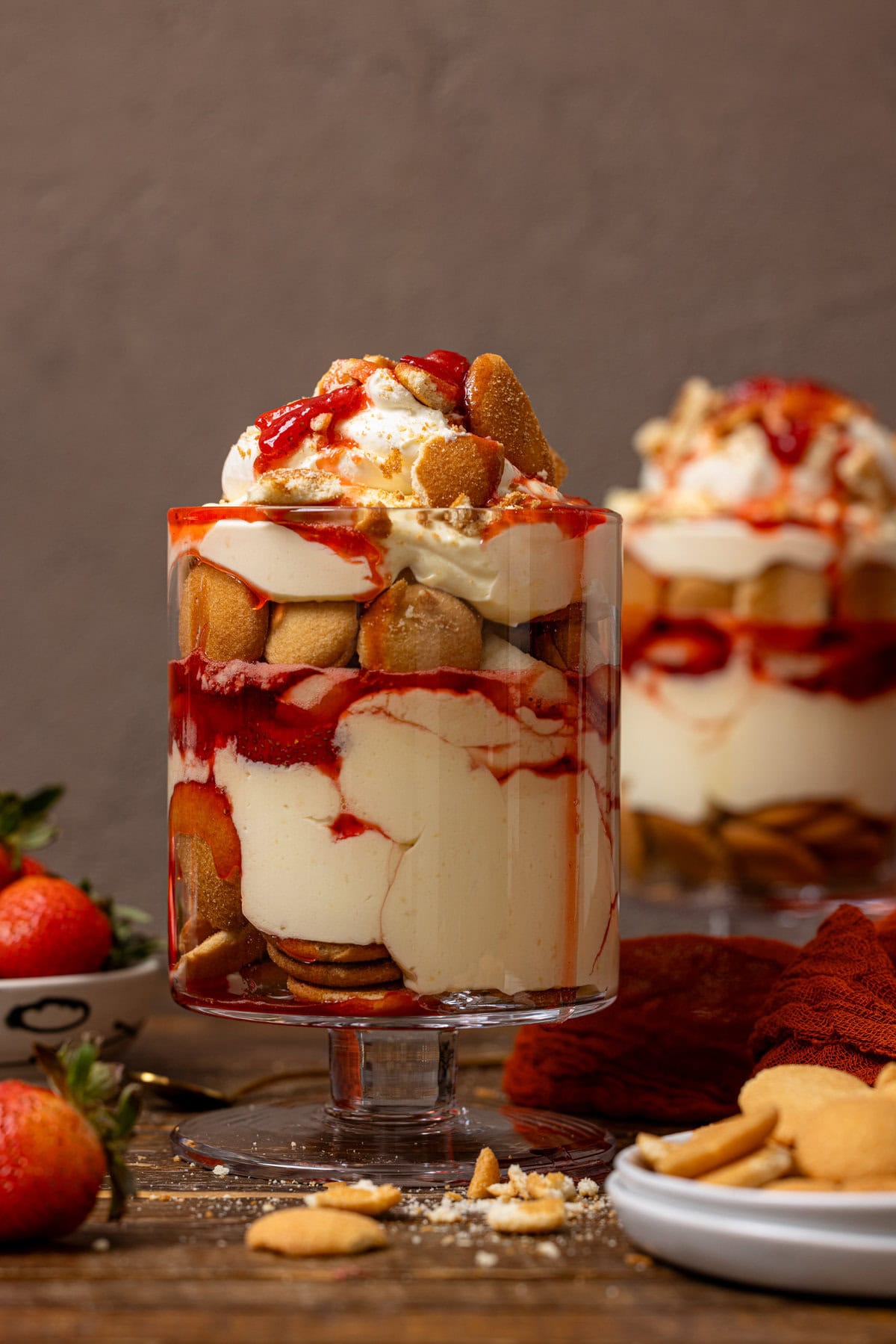 Two trifle bowls of strawberry banana pudding.