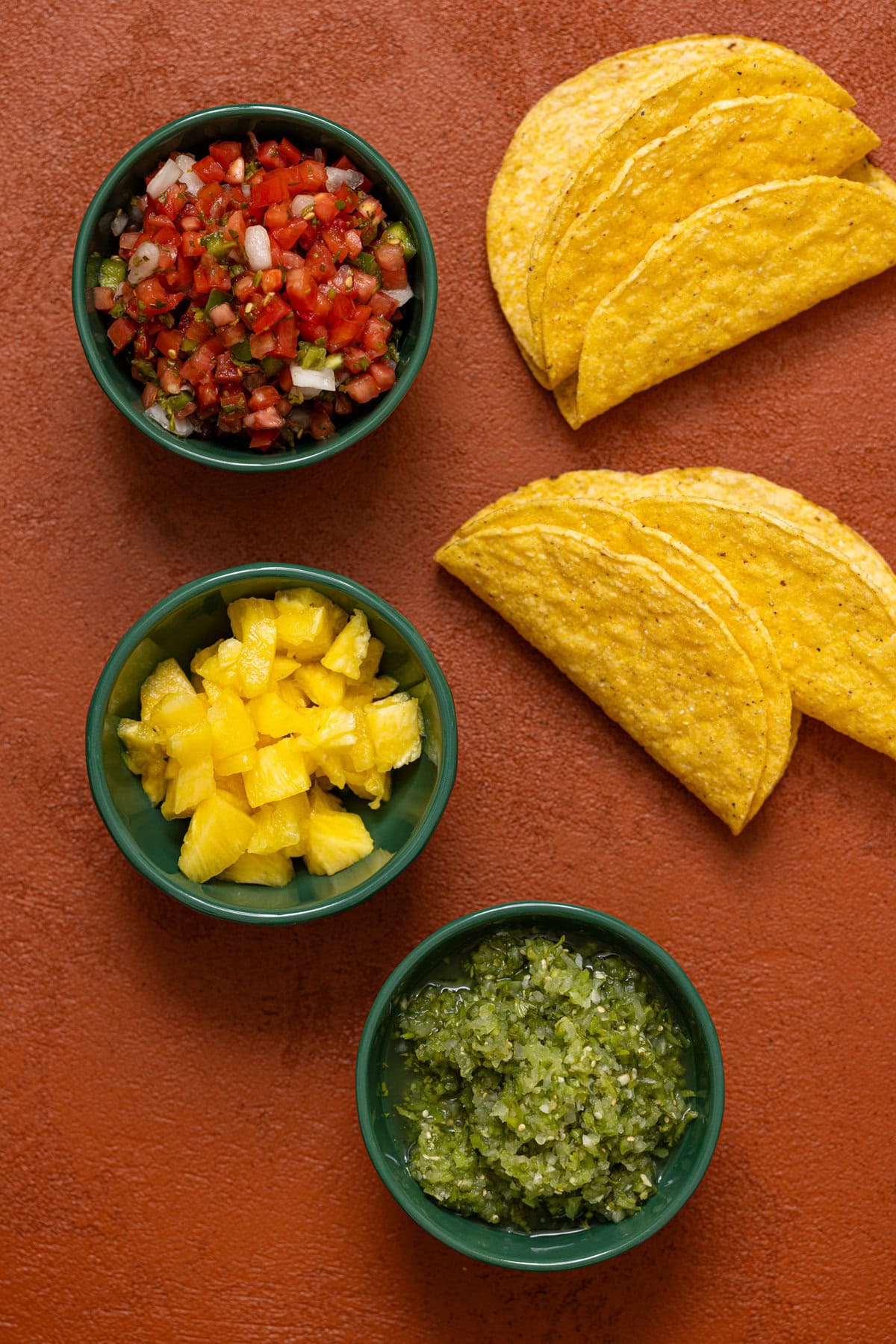 Ingredients on a burnt orange table.