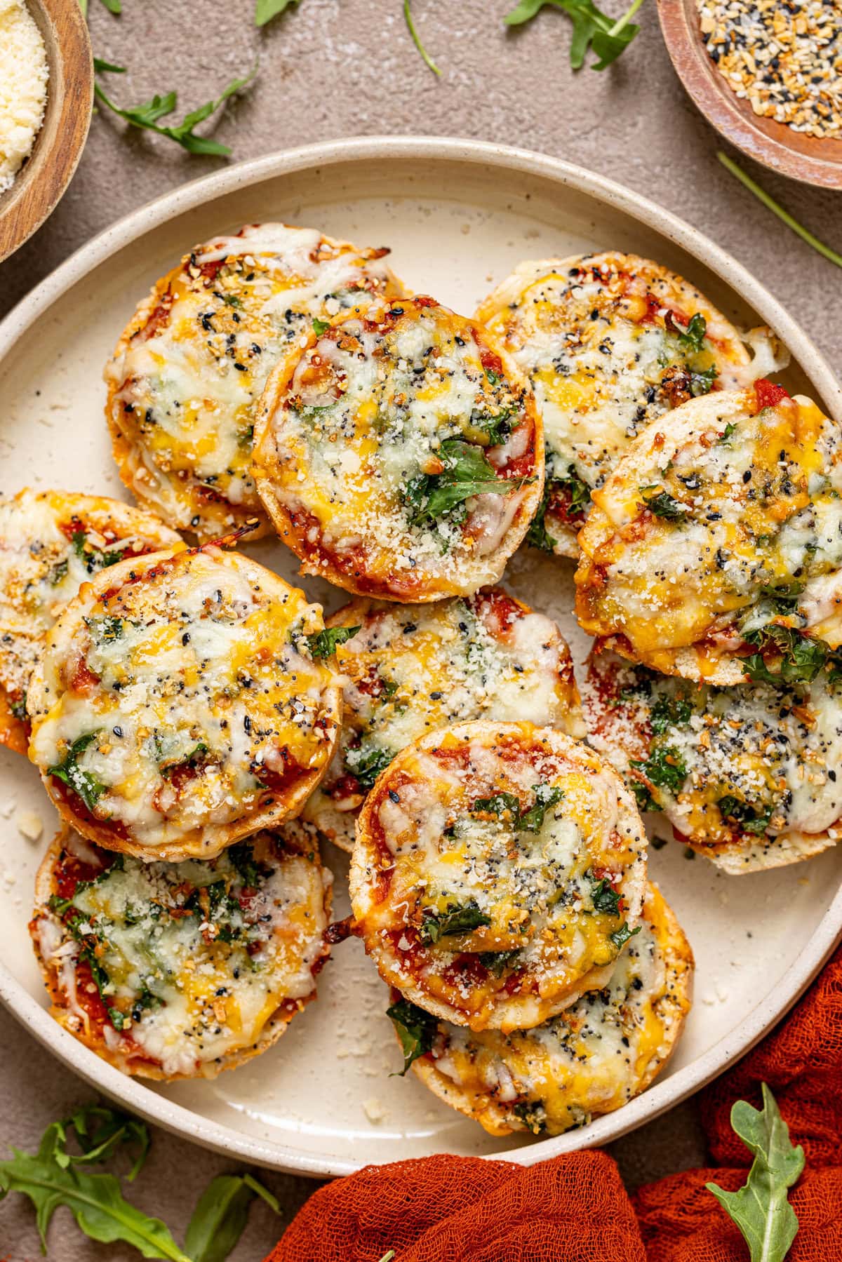 Pizza bites on a serving tray with garnish.