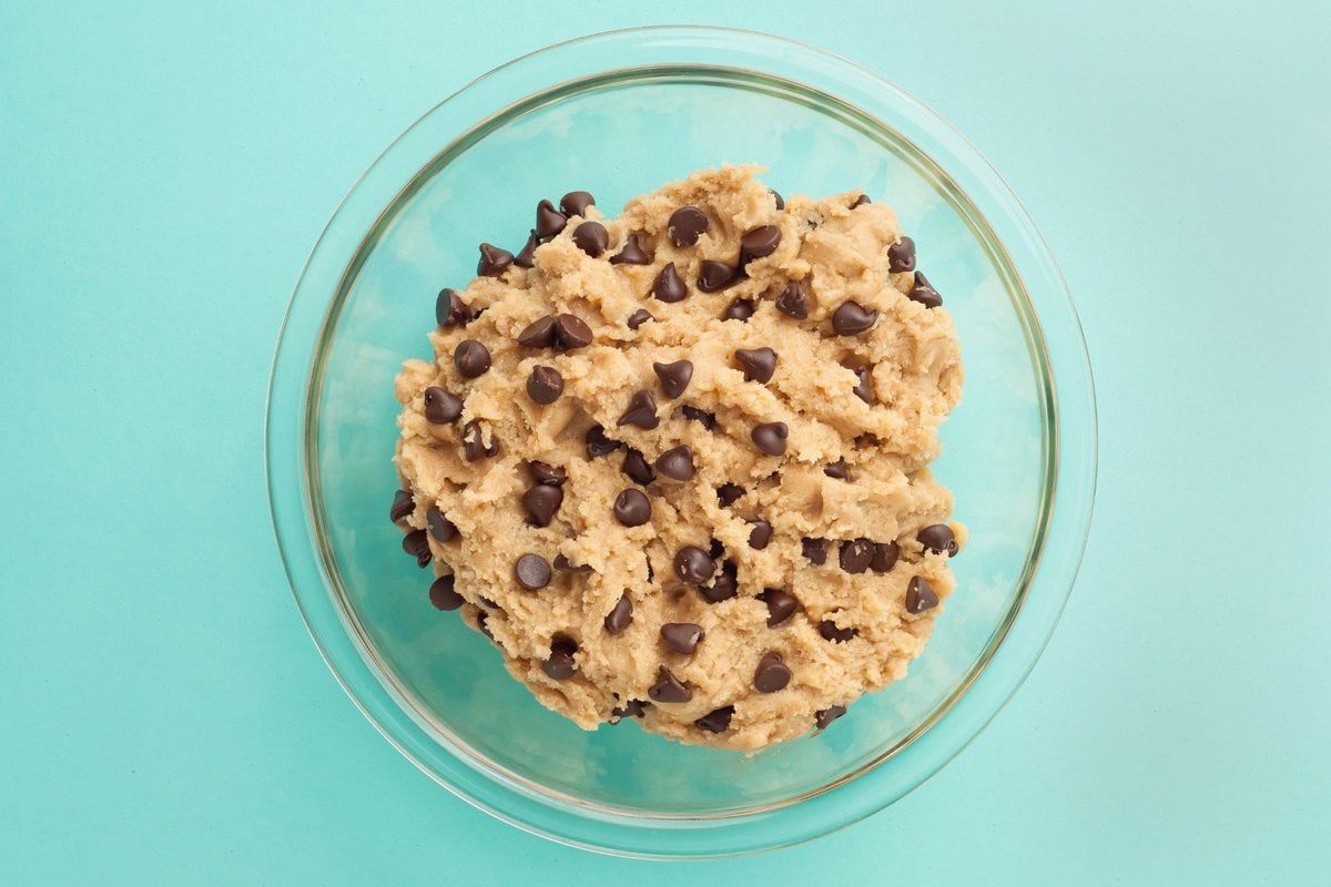 Choc chip cookie dough in glass bowl.