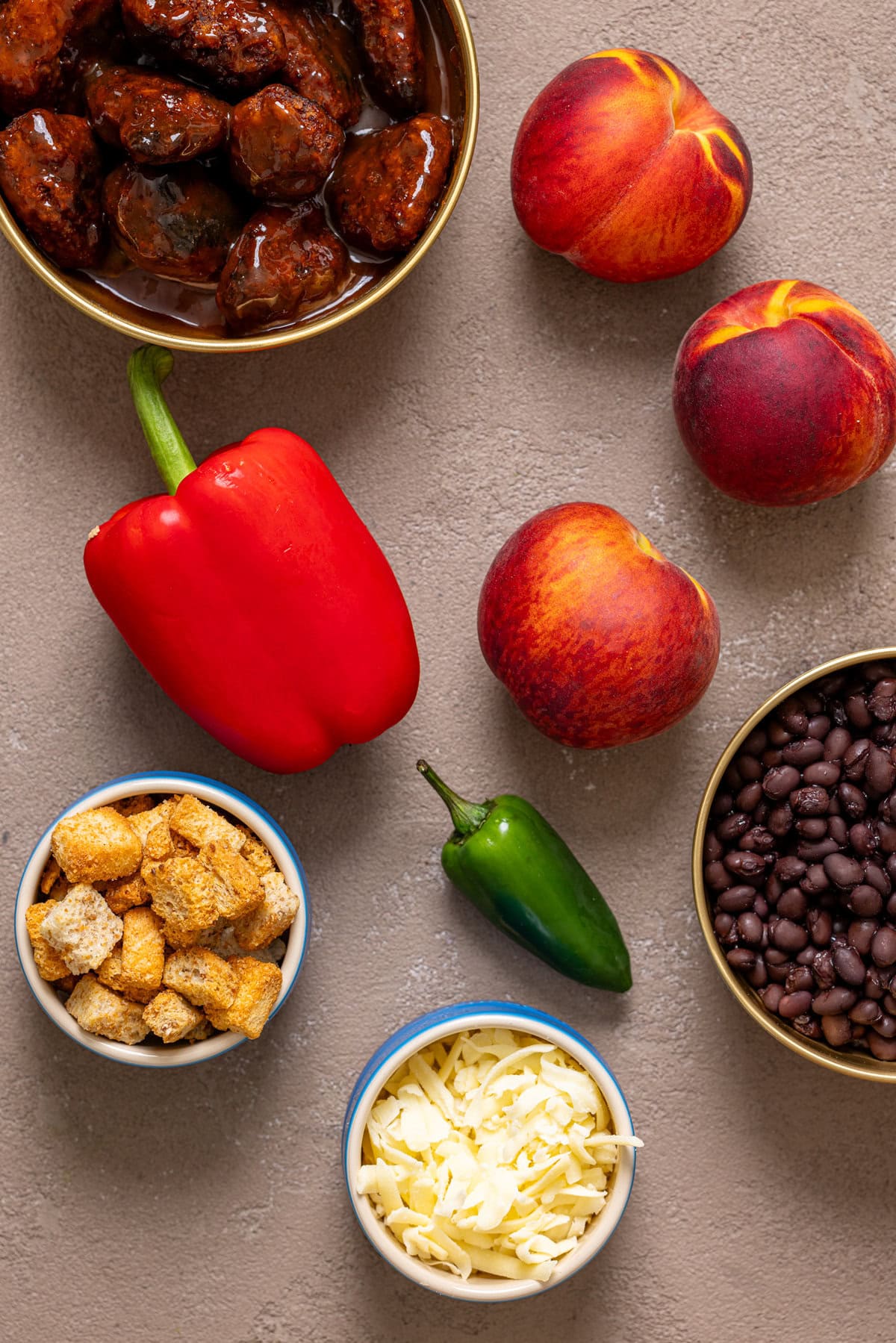 Ingredients on a brown-greyish table.