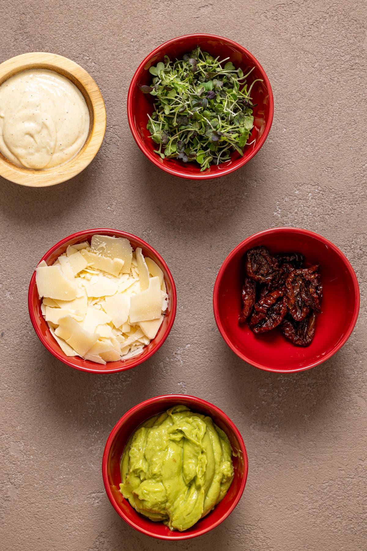 Ingredients on a greyish-brown table.