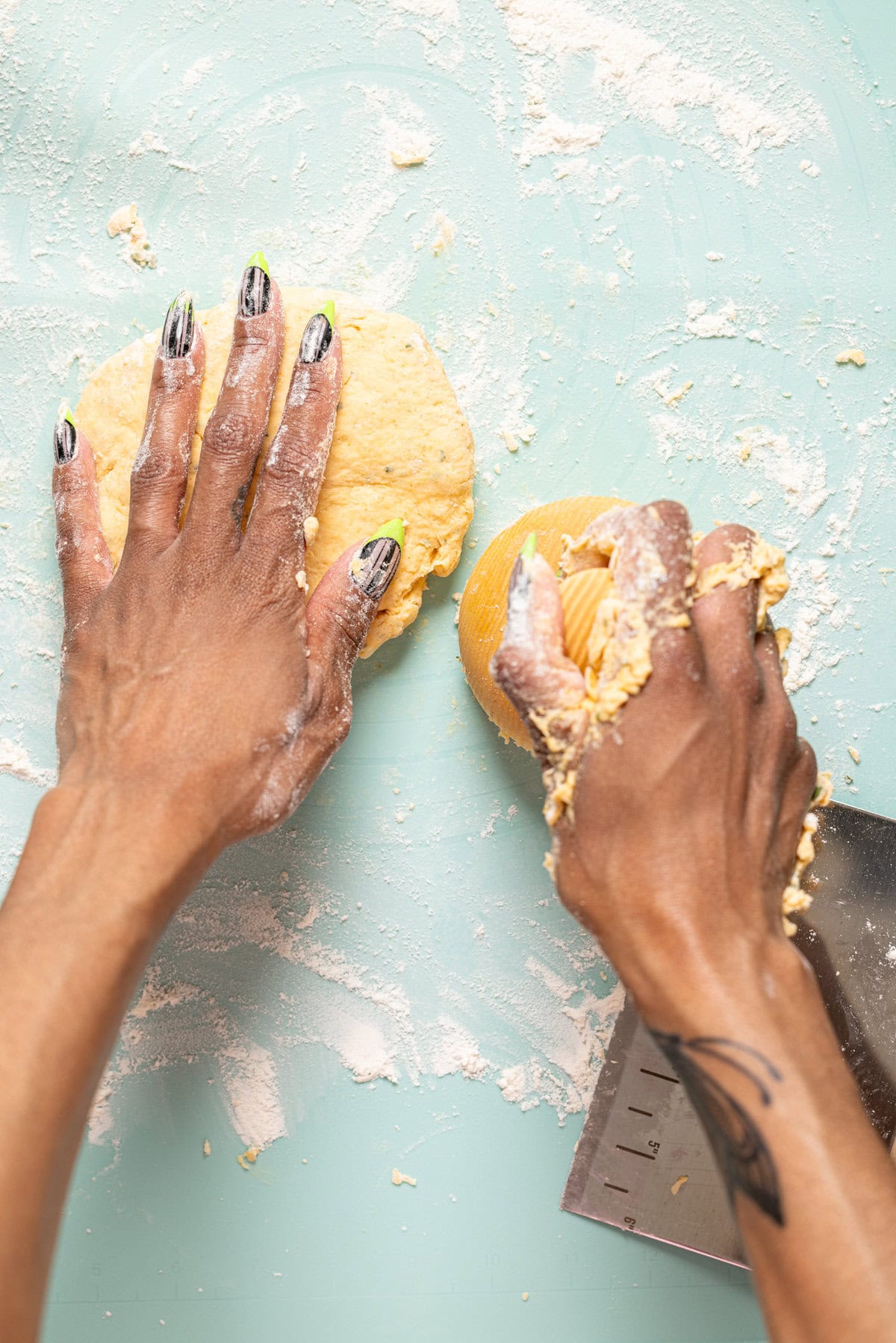 Biscuit dough on a surface being cut out into shapes.