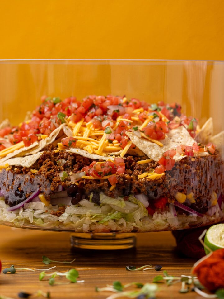 7-layer taco salad in a trifle bowl.