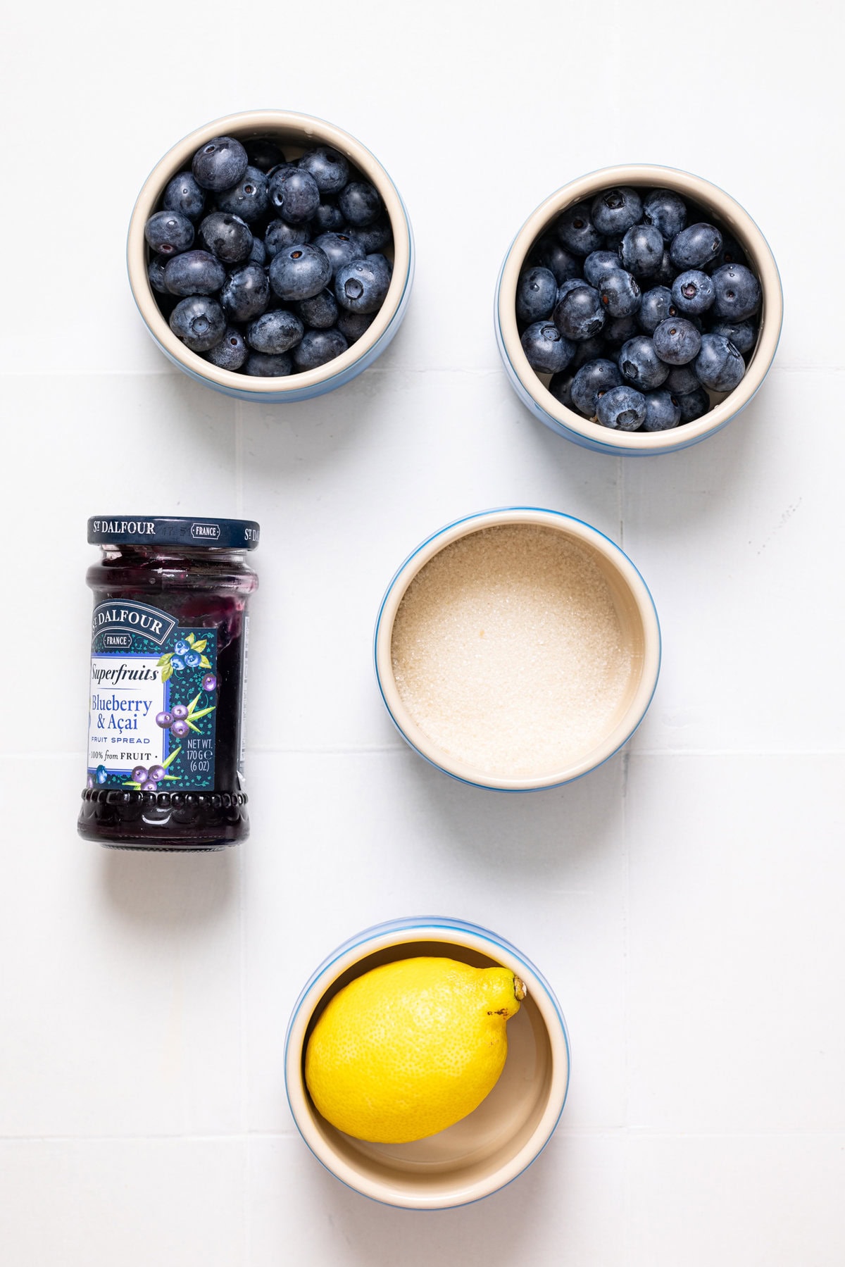 Ingredients on a white tile table.