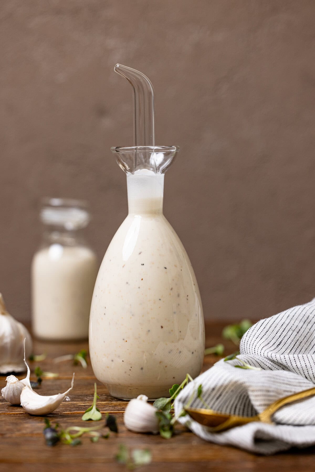 Creamy Caesar dressing in a bottle with garlic. 