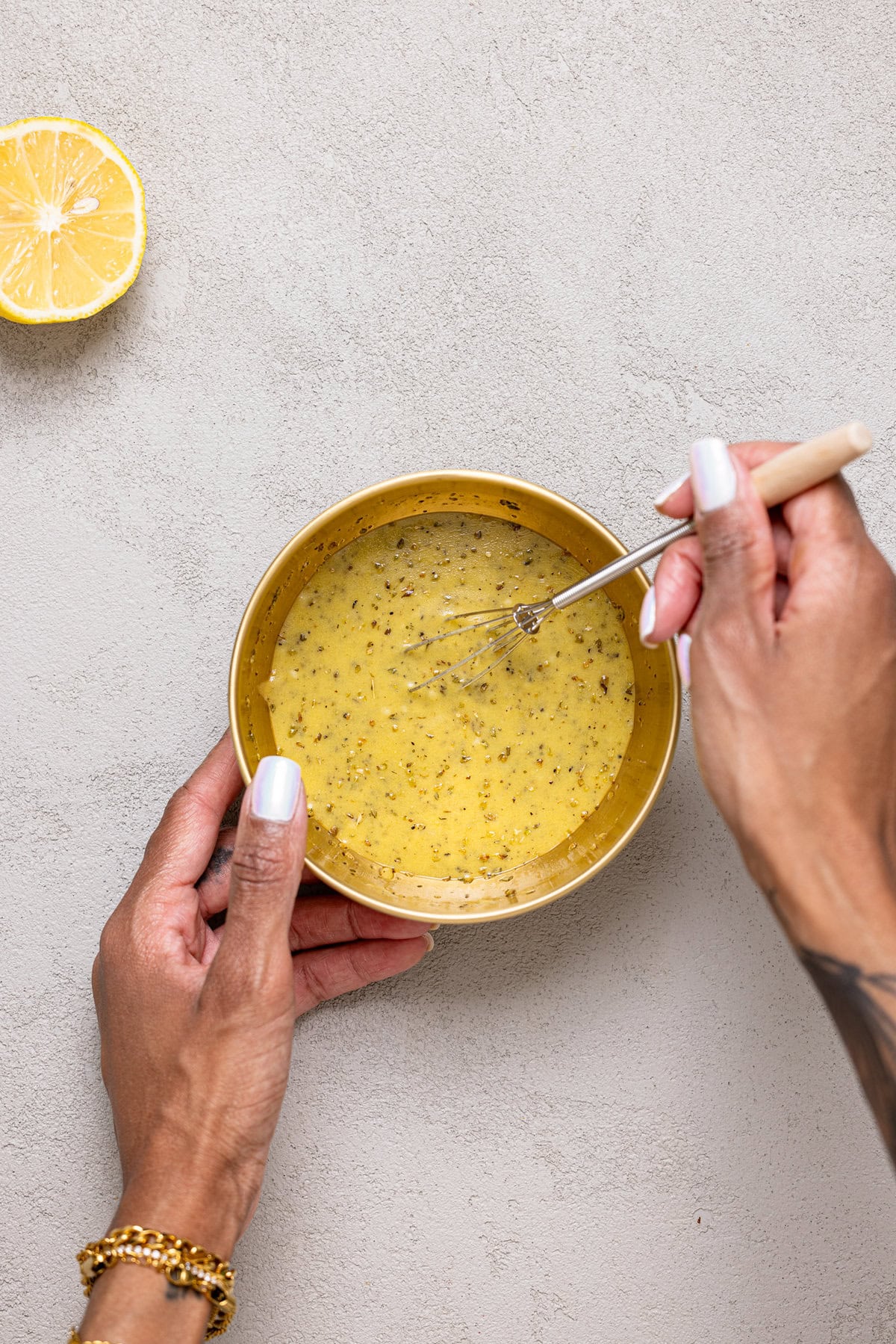 Ingredients being mixed together in a bowl with a spoon.