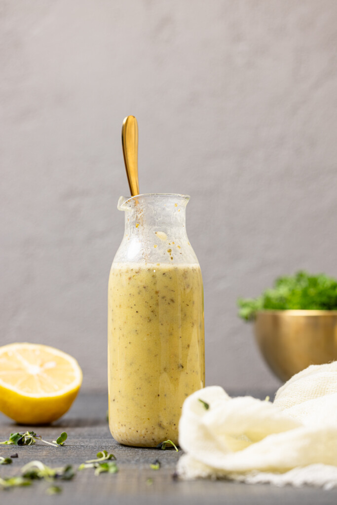 Dressing in a jar with a spoon.