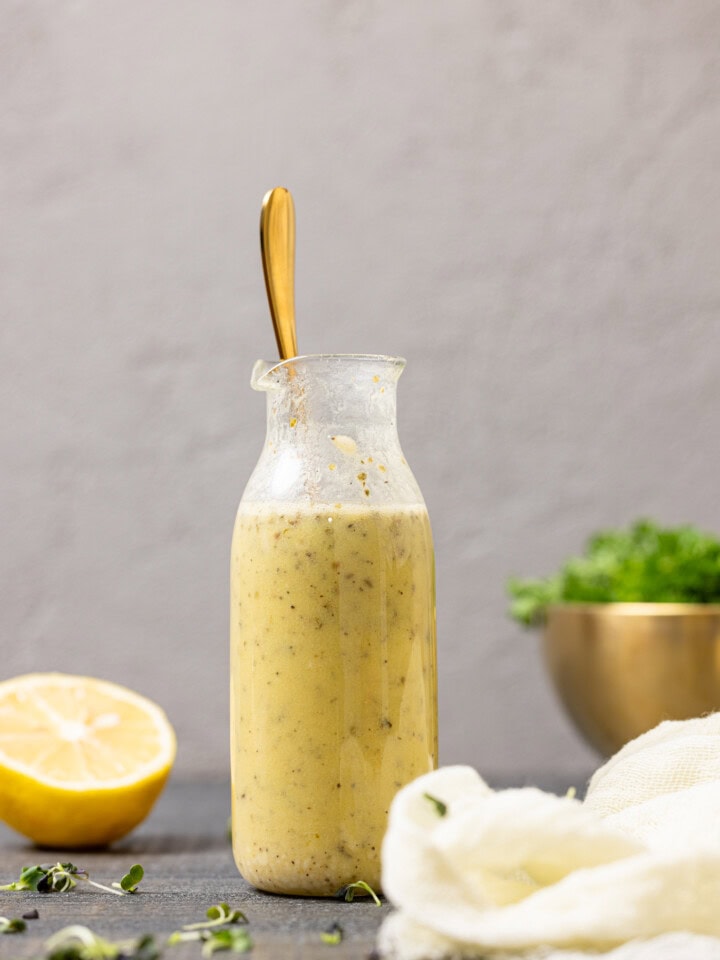 Dressing in a jar with a spoon.