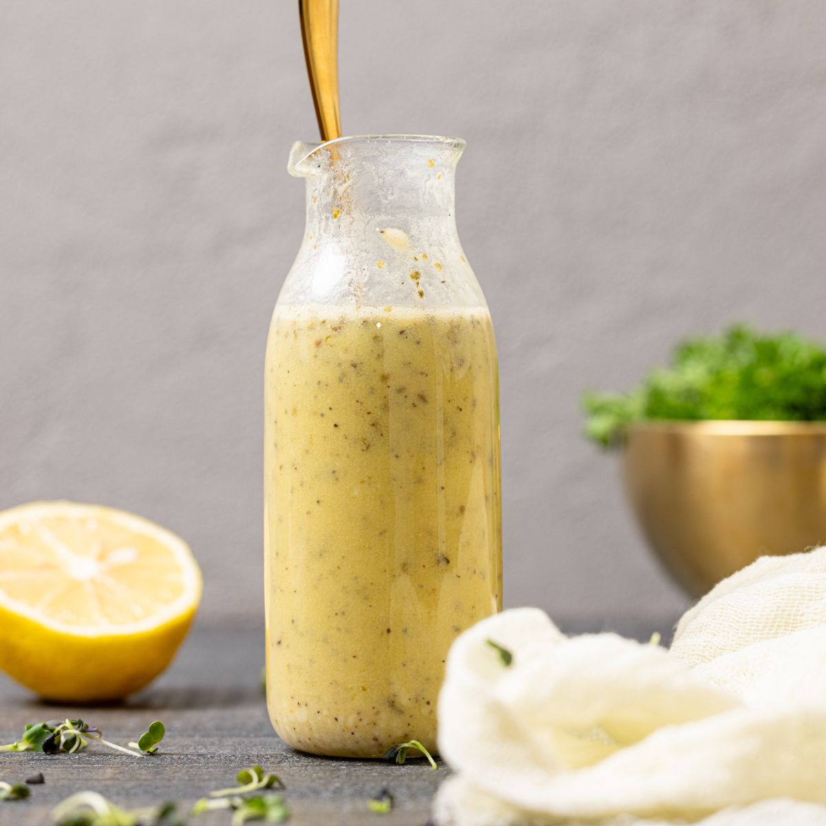 Dressing in a jar with a spoon.