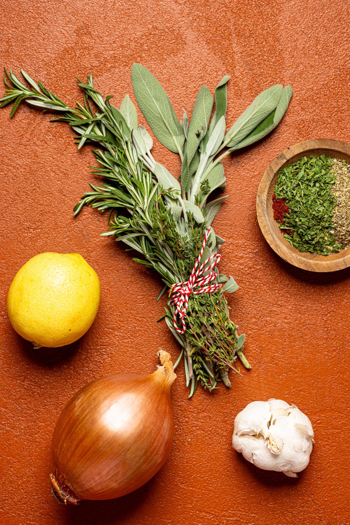 Ingredients on a burnt orange table.