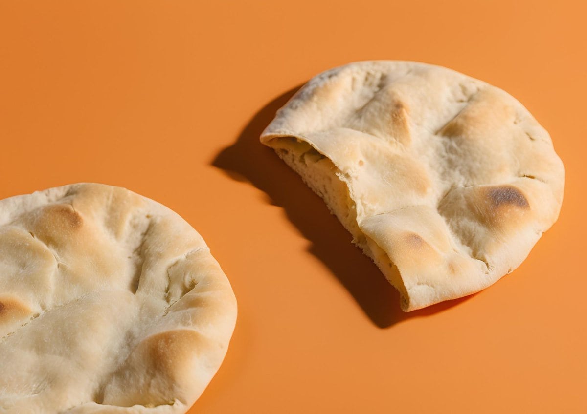 Pita bread on orange background.